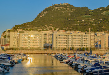 Gibraltar small boats marina reflected sunset