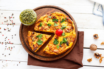 Homemade pie with egg and sausage and sauce 