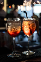 Aperol spritz bitter on bar counter with blurred background