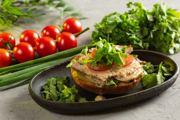 bruschetta with roast beef - baked veal tenderloin with salted cucumber, tomato, spinach and mustard sauce on a warm fried bun