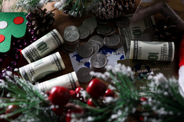 Dollars with coin lie on table chistmas background