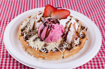 Waffles with ice cream, toping flavors and chantilly cream