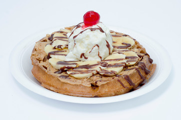 Waffles with ice cream, toping flavors and chantilly cream
