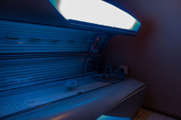 in a solarium there is an open solarium which is switched off
