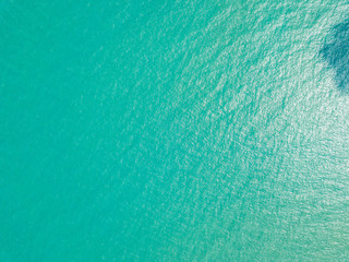 Aerial view of turquoise waves, water surface texture. Thailand