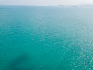 Aerial view of turquoise waves, water surface texture. Thailand