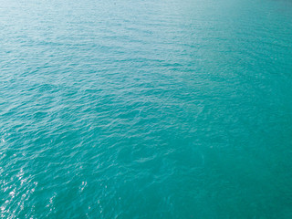 Aerial view of turquoise waves, water surface texture. Thailand