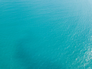 Aerial view of turquoise waves, water surface texture. Thailand