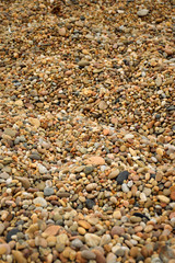 Narrow Depth of Field (linear horizontal focus in middle of picture) of Smooth Pebbles from a Rock Portuguese Beach, Porto, Portugal