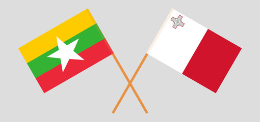 Crossed flags of Myanmar and Malta
