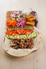 delicious doner kebab on wooden board