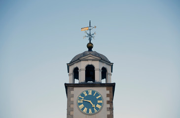 White clock tower picture with blue sky