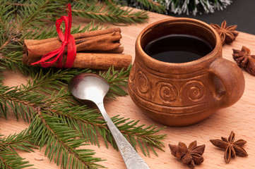Obraz na płótnie Canvas Christmas composition – cup of coffee, anise, cinnamon. On wooden background.