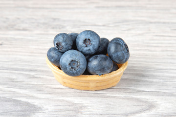 Blueberries in a waffle basket. Vitamins and wholesome foods