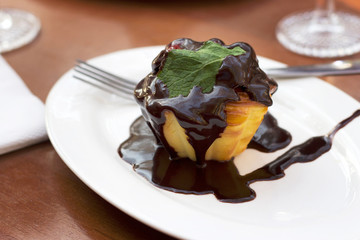 Cupcake with Chocolate and Green Mint Leaf