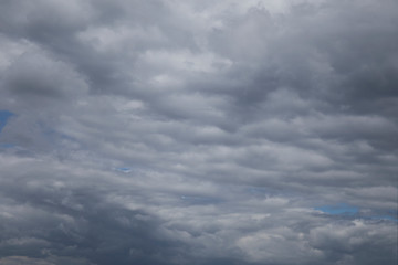 Thunderclouds over horizon. Rain, cloudy grey sky background.