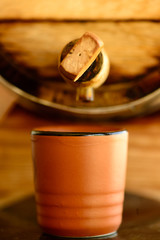 small barrel with cachaça and earthenware