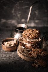 Sweet cookies with on dark textured background.