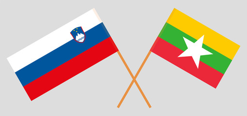 Crossed flags of Myanmar and Slovenia