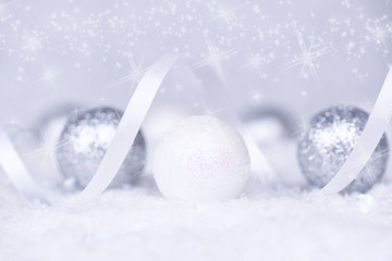 Christmas background. Christmas white and silver decorations on white snow