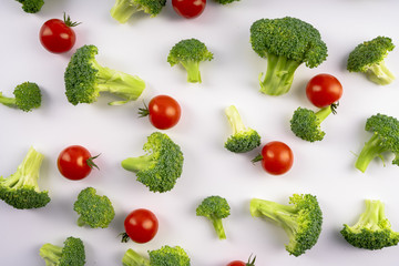 Healthy vegetable broccoli and tomatoes on white background