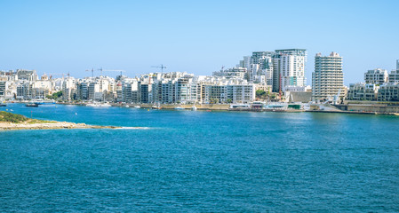 Fototapeta premium Valletta Malta, July 16 2019. Traditional Maltese architecture in Valletta Old Town in Malta, street with traditional balconies and old buildings in historical city of Malta.
