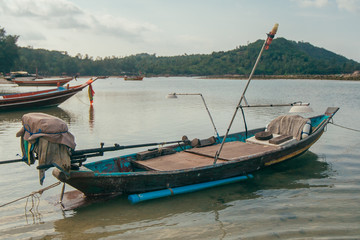 Fototapeta na wymiar Tropical Thai jungle lake Cheo lan wood boat, wild mountains nature national park ship yacht rocks