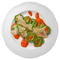 Vegetarian spinach ravioli, carrot sauce and ricotta. Gourmet restaurant menu. Isolated on white background. Flat lay top view