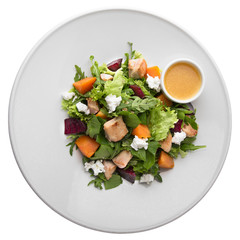 Dietary fitness salad of chicken, boiled carrots and beets, fett cheese, iceberg, arugula. Gourmet restaurant menu. Isolated on white background. Flat lay top view