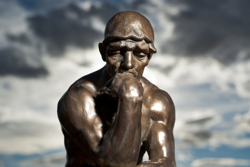 Fototapeta na wymiar Rodin's The Thinker - Replica Bronze Statue