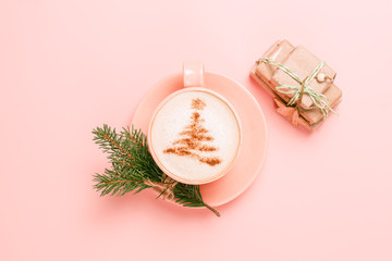 Top view of cup of latte with art in shape of Christmas tree