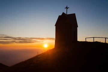 Dawn at the little church, mount Grappa landscape, Italy