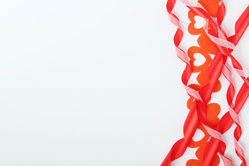 Background wit red ribbon and bright hearts for Valentine day decoration	