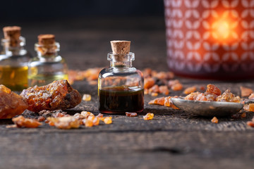 A bottle of myrrh essential oil with myrrh resin