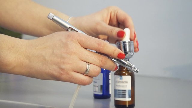 The process of preparing an oxygen facial treatment in beauty salon, dolly shot