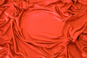 beautiful silk fabric in red draped with small folds, soft flowing, luxury concept, wedding, copy...