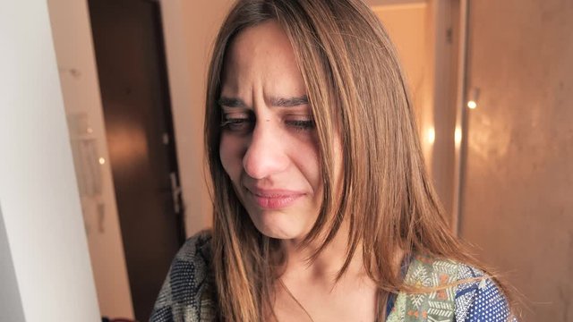 Beautiful Woman Cry. Face of young woman with tear drop close up. 4k