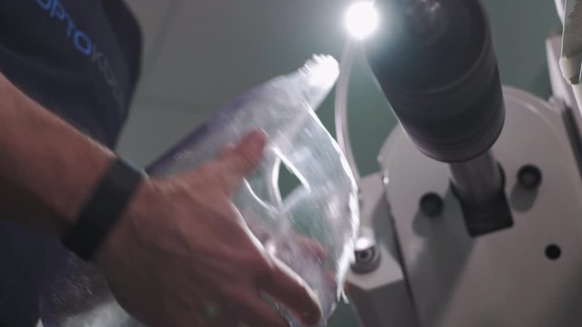 Production of a prosthetic leg. A man creates a part of the leg above the knee. Grinds the plastic part of the leg on a lathe. New body part.