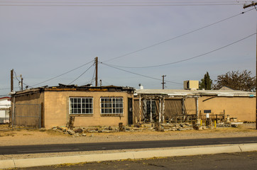 Fototapeta na wymiar Abandoned One Story Building With Fire Damage