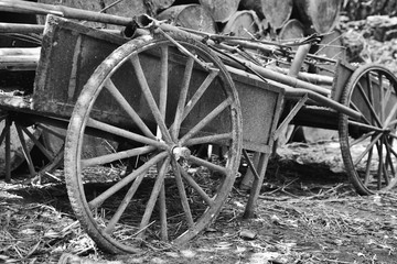 Fototapeta na wymiar A Black and white rustic vintage French farmers cart for transportation of farm produce.