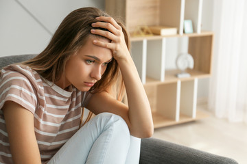 Portrait of depressed woman at home