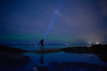 a man with an flashlight In Norway
