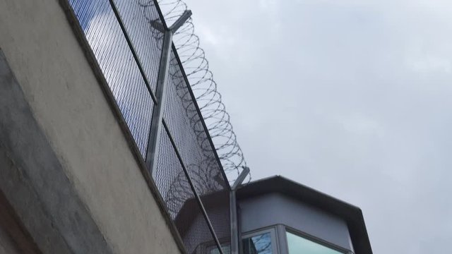 prison observation tower on a cloudy sky background. bottom view