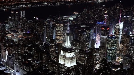 4K Aerial Sequence of New York City , USA - close-up view of the Empire State Building at Night as seen from a helicopter