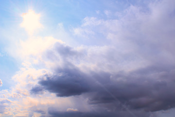 Fototapeta na wymiar Rain clouds, sun, and sun rays. Background. Landscape.