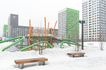 Large Playground. Simple modern Playground in the snow. New yards of Moscow.