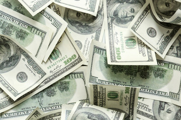 Heap of dollar banknotes as background