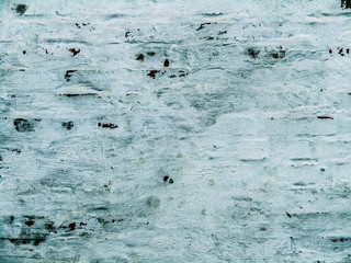 brick wall with peeling white paint. photo