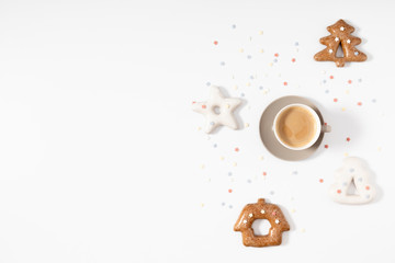 Christmas sweet composition. Xmas gingerbread cookies and coffee on white background. Christmas, New Year, winter concept. Flat lay, top view, copy space