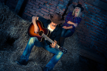 Country duet playing guitar and singing